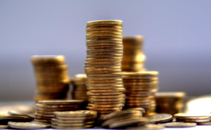 obraz prezentujący stosy złotych monet