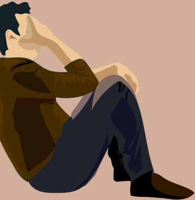 Na zdjęciu mężczyzna siedzący oparty plecami, podpiera głowę prawą ręką