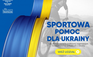 Flaga Ukrainy, w tle mężczyzna jedzie na rowerze.